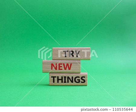 Try new Things symbol. Concept words Try new Things on wooden blocks. Beautiful green background. Business and Try new Things concept. Copy space. Try new Things symbol. Concept words Try new Things on wooden blocks. Beautiful green background. Business and Try new Things concept. Copy space. 110535644