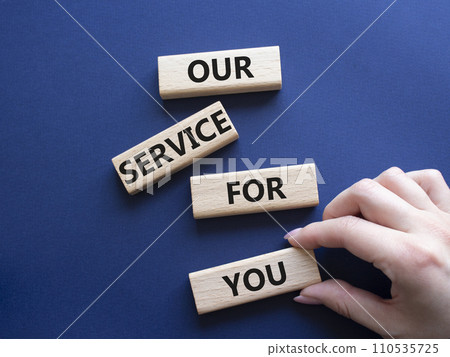 Our service for you symbol. Wooden blocks with words Our service for you. Beautiful deep blue background. Businessman hand. Business and Our service for you concept. Copy space. Our service for you symbol. Wooden blocks with words Our service for you. Beautiful deep blue background. Businessman hand. Business and Our service for you concept. Copy space. 110535725