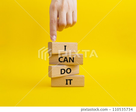 I can do it symbol. Concept words I can do it on wooden blocks. Beautiful yellow background. Businessman hand. Business and I can do it concept. Copy space. 110535734