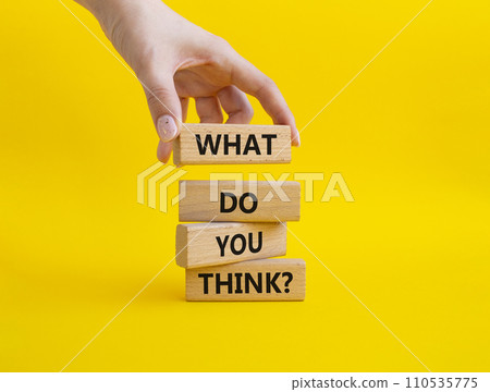 What do you think symbol. Wooden blocks with words What do you think. Businessman hand. Beautiful yellow background. Business and What do you think concept. Copy space. 110535775