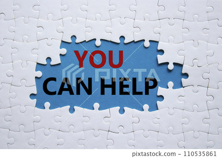 You can help symbol. Concept words You can help on white puzzle. Beautiful blue background. Business and You can help concept. Copy space. 110535861