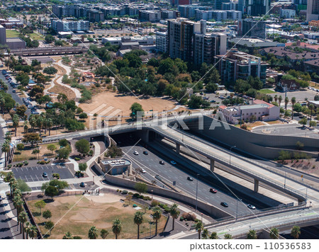 Aerial view of the highway and crossroads intersections in Phoenix, USA. Top up aerial drone view of elevated road and traffic junctions in USA metropolis during sunny day. 110536583