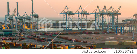 Thousands of shipping containers in the port of Long Beach near Los Angeles California. The Port of Long Beach in southern California during sunset. 110536781