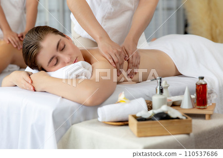 Caucasian couple customer enjoying relaxing anti-stress massage. Quiescent 110537686