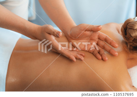 Closeup woman customer enjoying relaxing anti-stress massage. Quiescent Closeup woman customer enjoying relaxing anti-stress massage. Quiescent 110537695