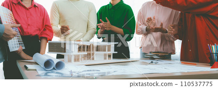 Interior designer team clapping hand to celebrate their project. Variegated. 110537775