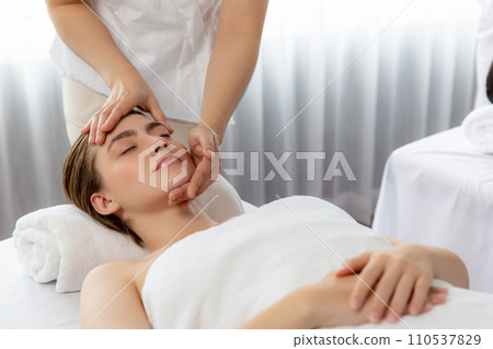 Caucasian woman enjoying relaxing anti-stress head massage. Quiescent 110537829