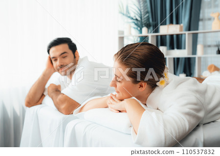 Caucasian couple customer enjoying relaxing anti-stress massage. Quiescent 110537832