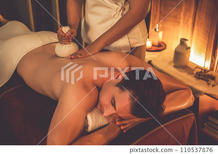 Hot herbal ball spa massage body treatment. Quiescent 110537876