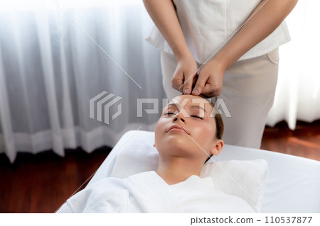Caucasian woman enjoying relaxing anti-stress head massage. Quiescent 110537877