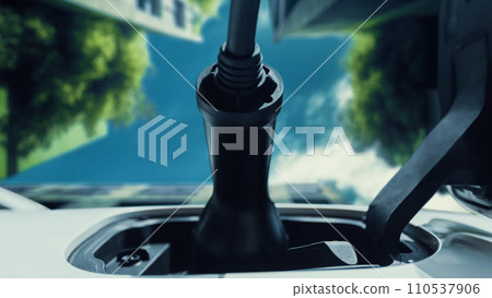 Future EV charger plugged into electric car for electric recharging. Peruse 110537906