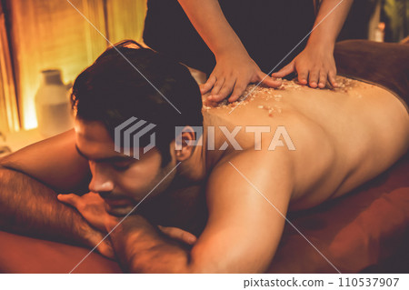 Man customer having exfoliation treatment in luxury spa. Quiescent 110537907