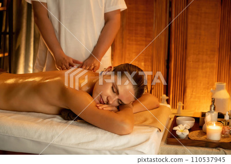 Caucasian woman customer enjoying relaxing anti-stress massage. Quiescent Caucasian woman customer enjoying relaxing anti-stress massage. Quiescent 110537945
