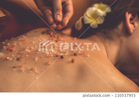 Closeup woman customer having exfoliation treatment in luxury spa. Quiescent 110537955