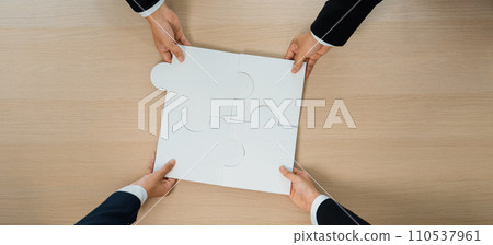 Top view panorama banner of business team assembling jigsaw puzzle. Shrewd 110537961