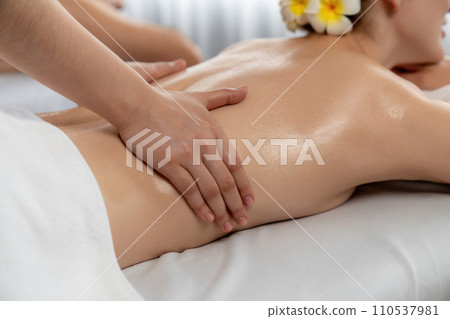 Caucasian couple customer enjoying relaxing anti-stress massage. Quiescent 110537981