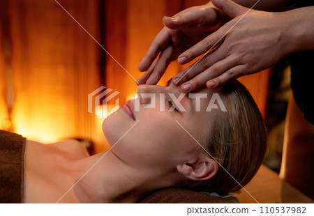 Caucasian woman enjoying relaxing anti-stress head massage. Quiescent 110537982