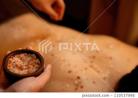 Closeup man customer having exfoliation treatment in luxury spa. Quiescent Closeup man customer having exfoliation treatment in luxury spa. Quiescent 110537998
