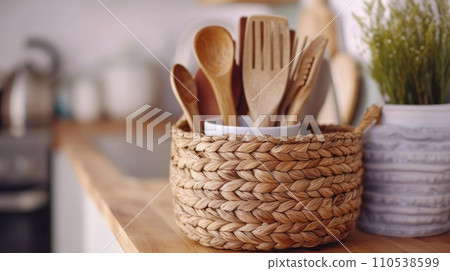 AI-generated content. A basket with wooden utensils on a counter top, AI 110538599