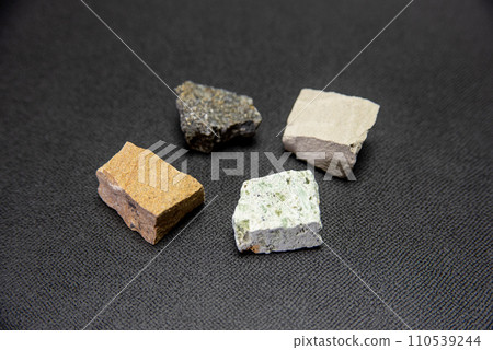 Various sedimentary rocks placed on a black background 110539244