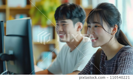 AI-generated content. Asian two couple sitting at a computer. Generative AI AI-generated content. Asian two couple sitting at a computer. Generative AI 110540221