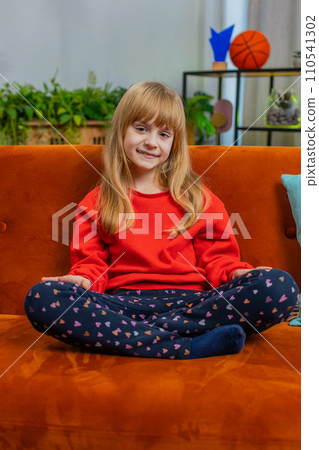 Portrait of happy smiling Caucasian preteen school girl child kid looking at camera, home play room Portrait of happy smiling Caucasian preteen school girl child kid looking at camera, home play room 110541302