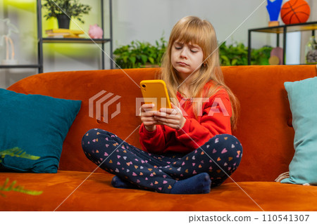 Child kid girl use smartphone, playing game loses surprised lottery result fail education study test Child kid girl use smartphone, playing game loses surprised lottery result fail education study test 110541307