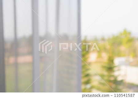 window curtain with green garden abstract blur background 110541587