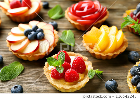 Assortment of gorgeous fruit tarts 110542243