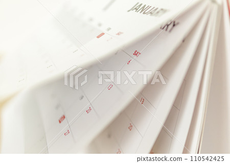 Calendar page flipping sheet close up blur background business schedule planning appointment meeting concept 110542425