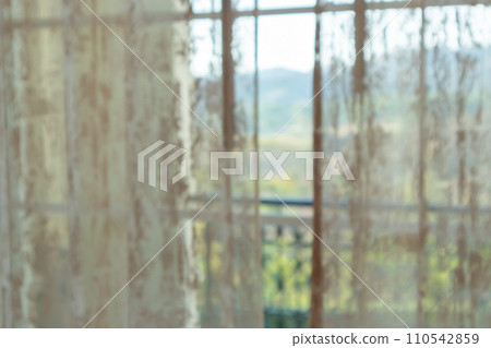Abstract blur curtain window with green garden background Abstract blur curtain window with green garden background 110542859