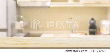 Black wood counter top with blurred kitchen background 110542869