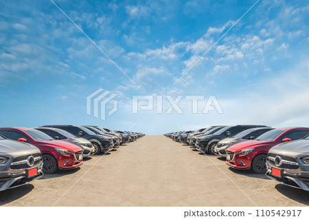 Lot of used car for sales in stock with sky and clouds Lot of used car for sales in stock with sky and clouds 110542917