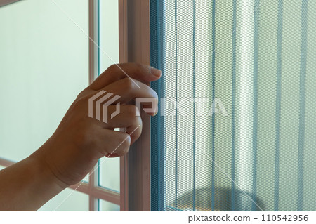 Hand hold pleated mosquito net wire screen handle on house window Hand hold pleated mosquito net wire screen handle on house window 110542956