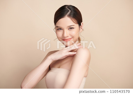Beautiful young asian woman with clean fresh skin on beige background, Face care, Facial treatment, Cosmetology, beauty and spa, Asian women portrait. 110543570