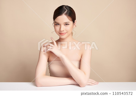 Beautiful young asian woman with clean fresh skin on beige background, Face care, Facial treatment, Cosmetology, beauty and spa, Asian women portrait. 110543572