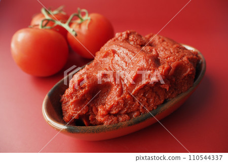 Tomato paste with ripe tomatoes. Tomato paste with ripe tomatoes. 110544337