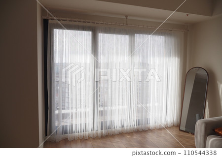 white clean fabric curtain in a living room white clean fabric curtain in a living room 110544338