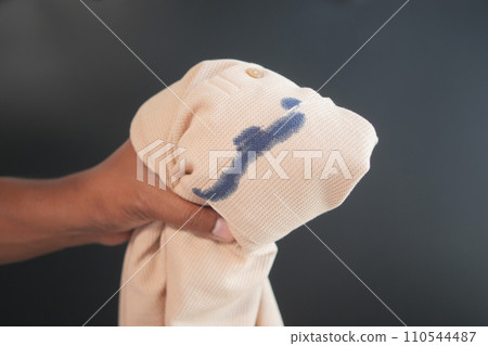 shirt with blue ink stain . shirt with blue ink stain . 110544487