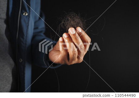man hold his list hair close up man hold his list hair close up 110544490