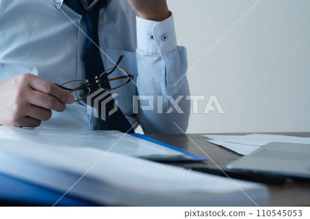 Businessman tired from work 110545053