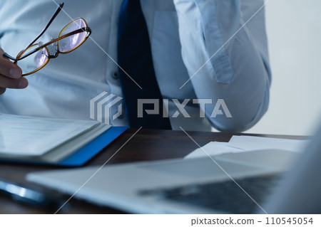 Businessman tired from work 110545054