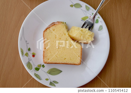 Tea time scene with lemon cake and black tea Tea time scene with lemon cake and black tea 110545412
