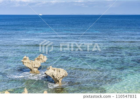 A heart rock floating in the blue sky and sea, Tinu Beach, Nakijin Village, Okinawa Prefecture A heart rock floating in the blue sky and sea, Tinu Beach, Nakijin Village, Okinawa Prefecture 110547831