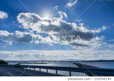 Blue sky and Kouri Bridge silhouette, Nago City, Okinawa Prefecture 110548144