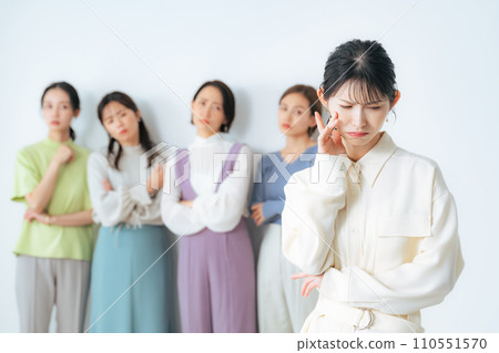 A woman who is worried about being left out of the group A woman who is worried about being left out of the group 110551570