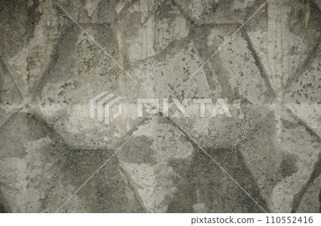 Pattern of grey volumetric texture made by casting wall ready for replicate on background. Unusual relief embossment . Concrete wall with traces of aging cracks, destruction and streaks 110552416
