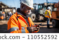 Black African mining construction worker with smartphone. Generative AI. Fictional person.  110552592