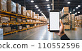 Smartphone mockup in male hand. Mobile phone with blank screen warhouse background. Advertisement application design or mock-up text.Storage app distribution business concept. Generative AI. 110552596