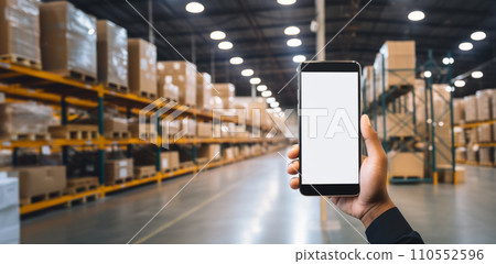 Smartphone mockup in male hand. Mobile phone with blank screen warhouse background. Advertisement application design or mock-up text.Storage app distribution business concept. Generative AI. 110552596